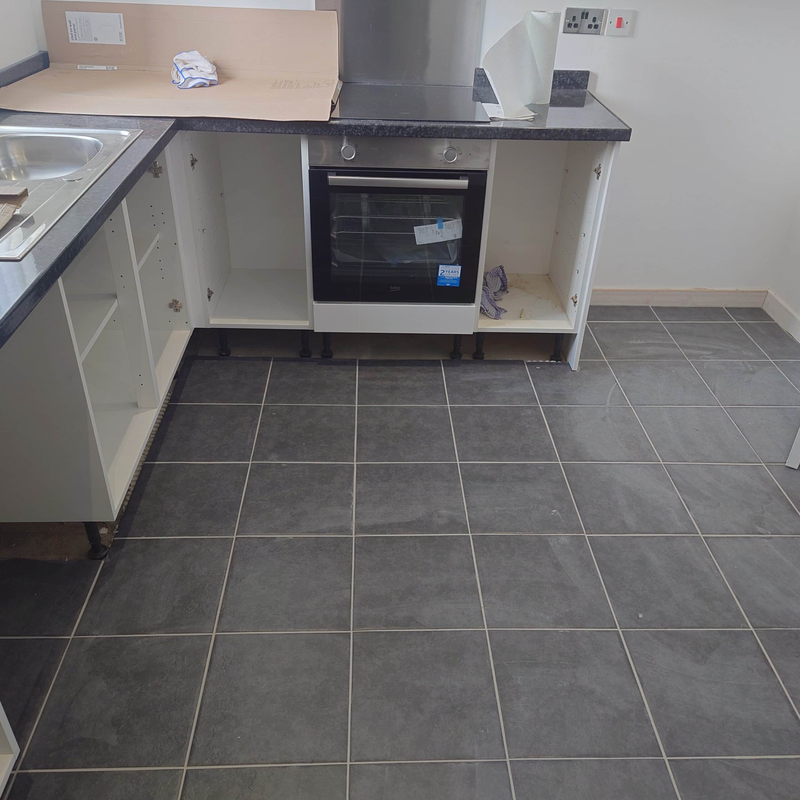 Slate floor tiles in a modern kitchen setting, showcasing durable and stylish flooring.